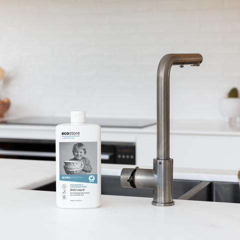 bottle of ecostore ultrasensitive dishwash liquid near kitchen sink