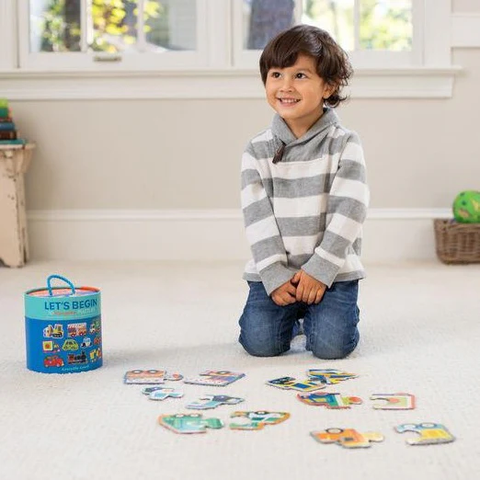 child doing Crocodile Creek Let's Begin Puzzle 2 pc - Vehicles